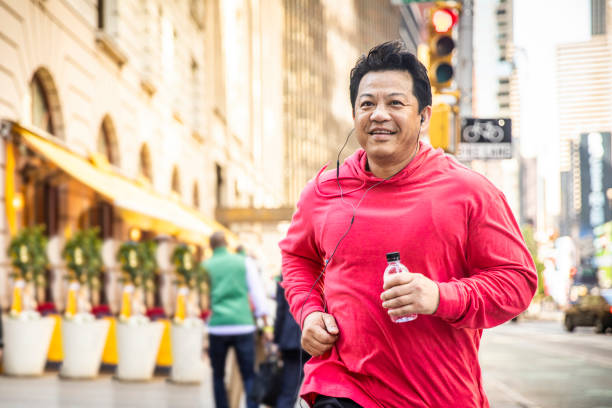 istock Mature Hispanic Man Running in City 1152509116