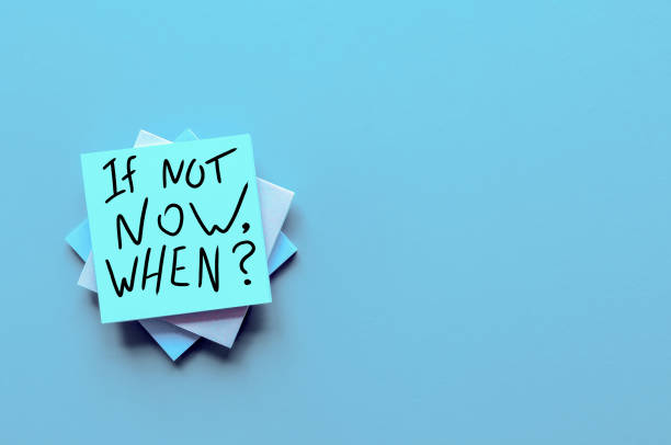 istock If Not Now When, text on a stack of note paper. Motivating and inspiring question, mockup and template, space for text 1152510094