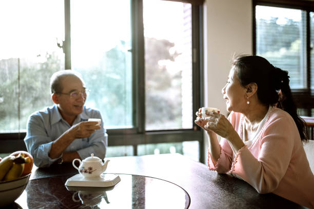 istock Happy Senior Taiwanese couple enjoying tea time 1152515601