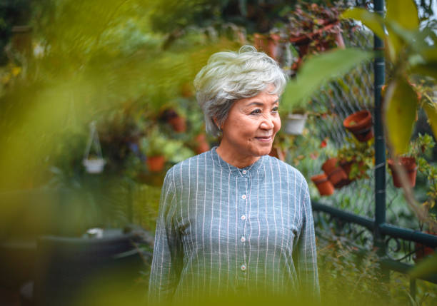 istock Smiling senior woman looking away in back yard 1152517199