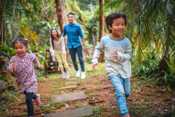 istock Parents cheering children running in back yard 1152517200