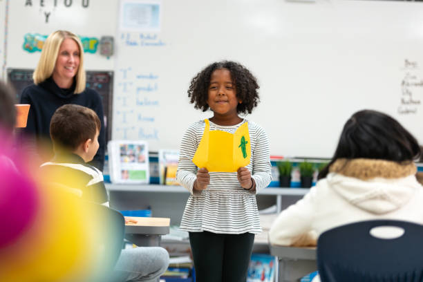 istock Young African Girl Presenting to Her Class 1152517608