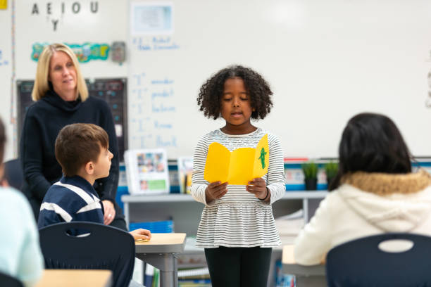 istock Young African Girl Presenting to Her Class 1152517612
