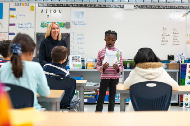 istock Young African Girl Presenting to Her Class 1152517629