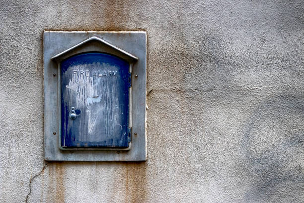 istock Abstract building wall with antique fire alarm 1152524308