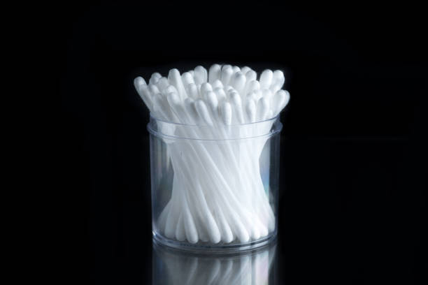 Cotton buds or cotton swabs on black background