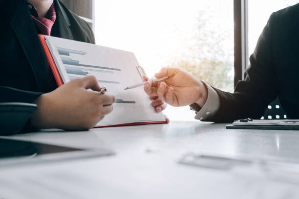 istock Business people analyzing investment graph meeting brainstorming and discussing plan in meeting room, investment concept 1152529267