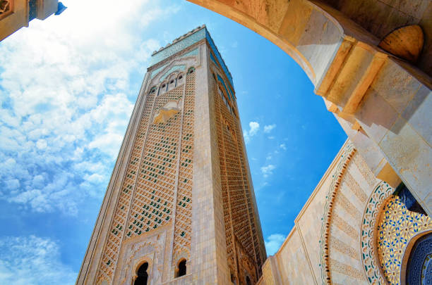 istock Hassan II mosque during day, with blue and sunny sky, showing Islamic Architecture with Artistic patterns and a view of its remarkable highest minaret, Casablanca, Morocco - Image 1152529301