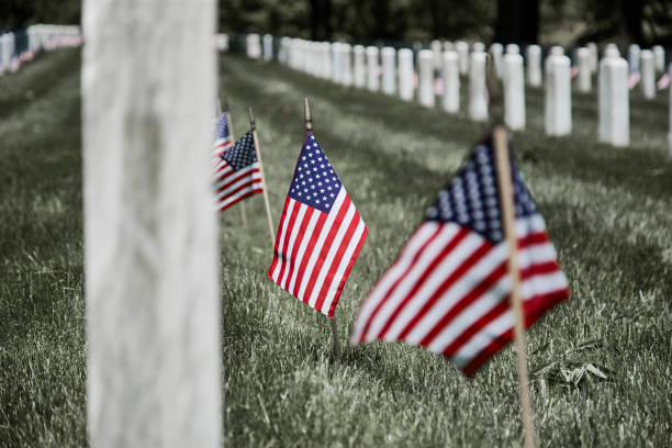 istock American Flags on Soldier's Gravesite 1152533566