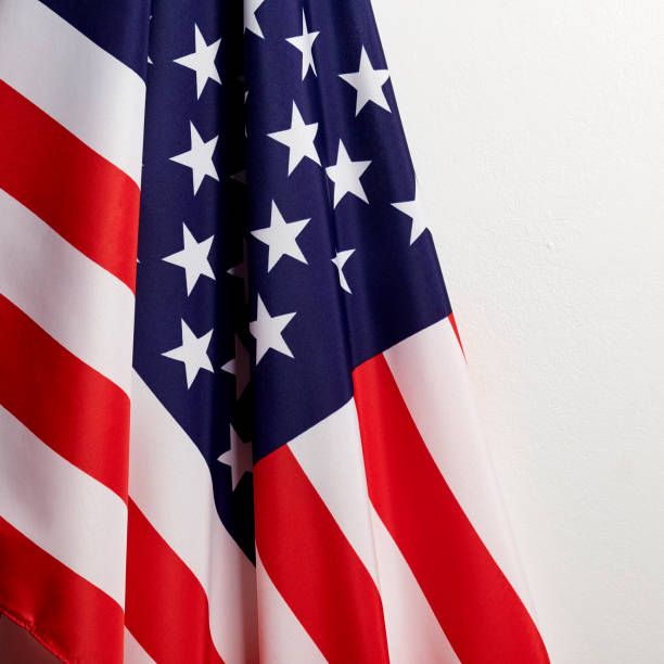 istock 4th of july independence day American flags white background 1152536864