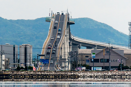 Matsue, Shimane, Japan - Apr 28, 2019: Eshima Ohashi Bridge is the largest rigid-frame bridge in Japan that connects Matsue, Shimane and Sakaiminato, Tottori over Nakaumi lake. It is known by the nickname of 'Betabumizaka'.