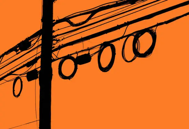 Telephone Pole and Loops of Wire in front of an orange sky