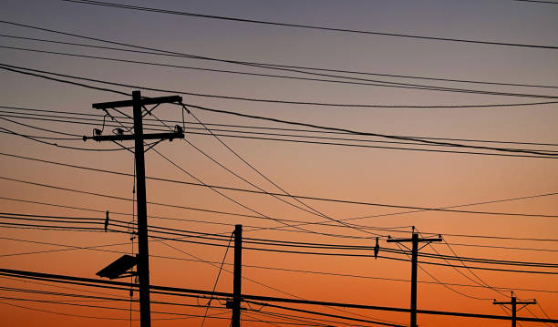 istock Many Power Lines in front of colorful Sky 1152539368