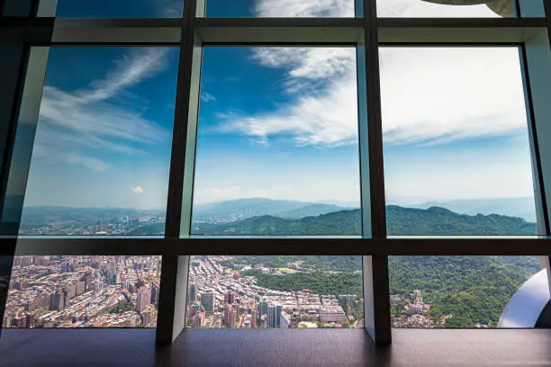 The view across Taipei from the top of Taipei 101, a supertall skyscraper in Xinyi District, Taipei, Taiwan. The building was officially classified as the world's tallest from its opening in 2004 until the 2010 completion of the Burj Khalifa in Dubai.