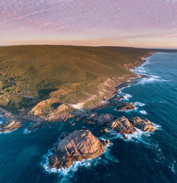 Aerial photograph capturing the beautiful Sugarloaf Rock located in Margaret River, Western Australia on sunset.