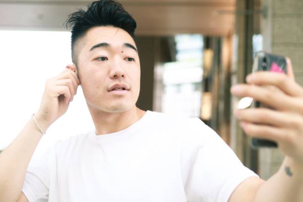 istock A asian man is using wireless headphones 1152545312