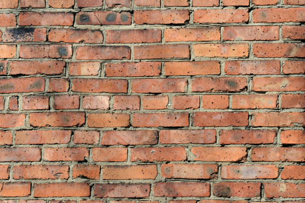 istock Old red brick wall background. Brick wall texture close up 1152546396