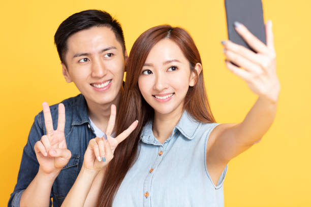 istock young woman making selfie with boyfriend 1152549086