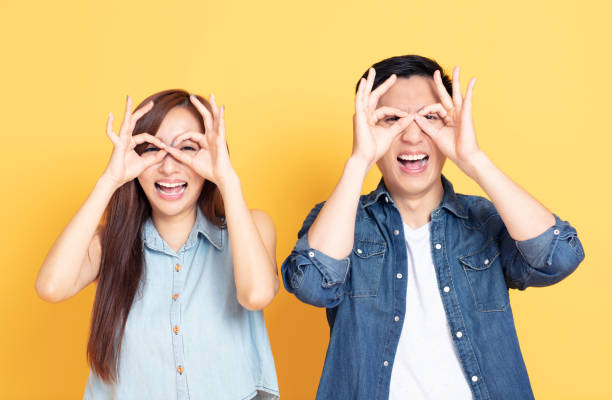 istock happy  young couple showing the looking gesture 1152549652