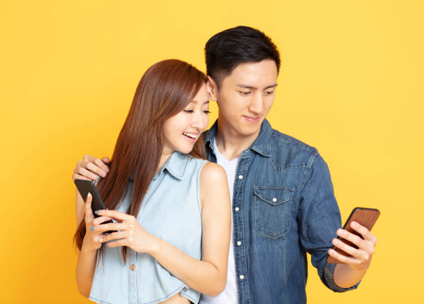 istock Happy Asian couple watching the smartphone 1152549700