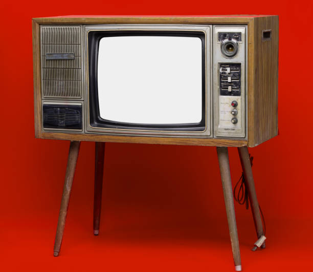istock Vintage TV : old retro TV set isolated on red background. 1152551958