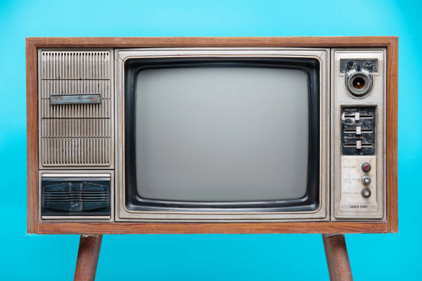 istock Vintage TV : old retro TV set isolated on blue background. 1152551978