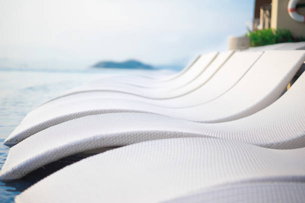 Relaxing pool bed beside swimming pool.