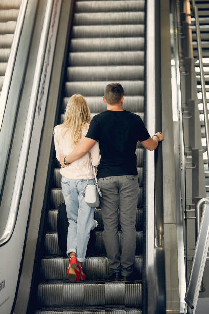 istock Beautiful couple standing in a airport 1152555942