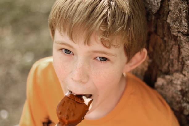 istock Kids eating Ice cream. Outdoor. Summer time. 1152555954