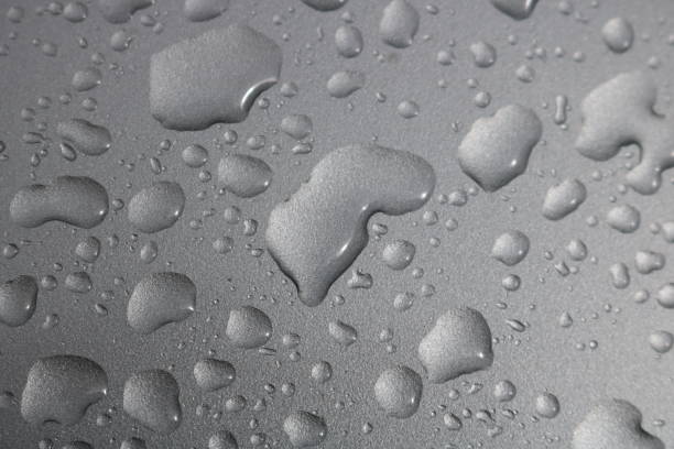 istock Raindrops on gray metal background 1152556301