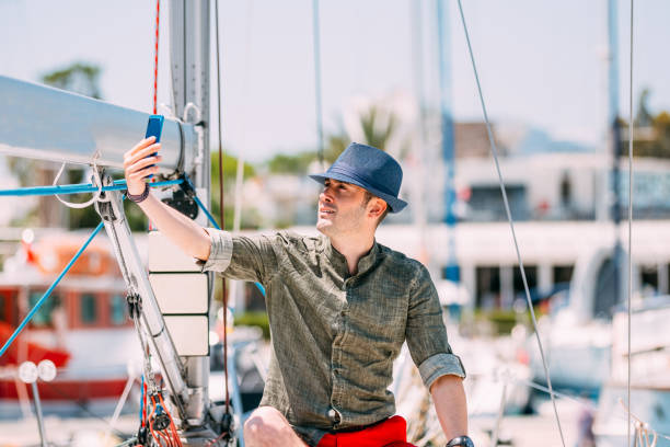 istock Young Man Taking Selfie on Yacht 1152558180
