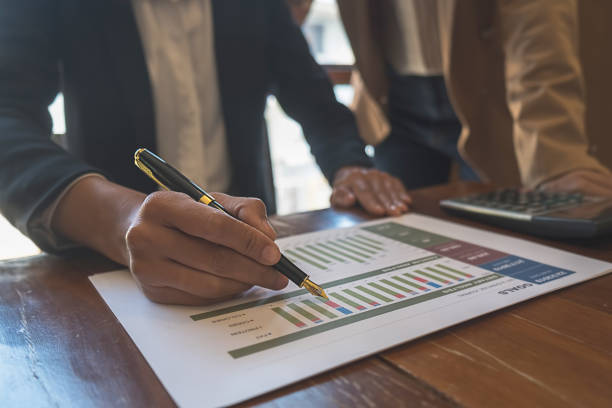 istock Business team brainstorming and discussing with financial data and report graph. Teamwork meeting working concept. 1152559886