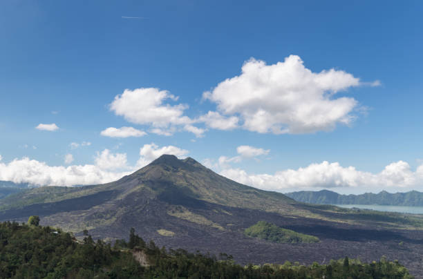 istock Mount Agung volcano against a blue sky 1152566353