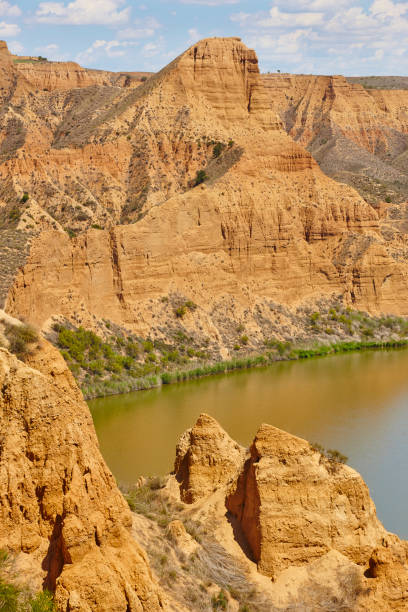 istock Red clay erosion gully and river. Eroded landscape. Spain 1152567198