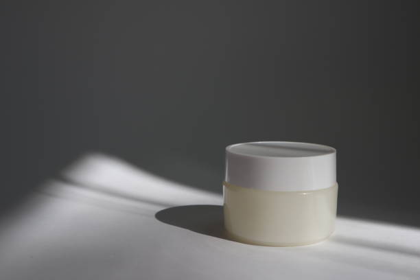 istock White plastic tube with round cap on white background with shadows. Front view for your design. facial cosmetic products. Spa concept. Beauty blogger, salon treatments concept. 1152567520