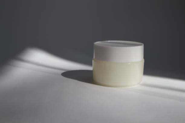 istock White plastic tube with round cap on white background with shadows. Front view for your design. facial cosmetic products. Spa concept. Beauty blogger, salon treatments concept. 1152567552