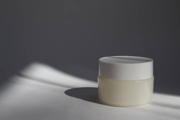 istock White plastic tube with round cap on white background with shadows. Front view for your design. facial cosmetic products. Spa concept. Beauty blogger, salon treatments concept. 1152567576