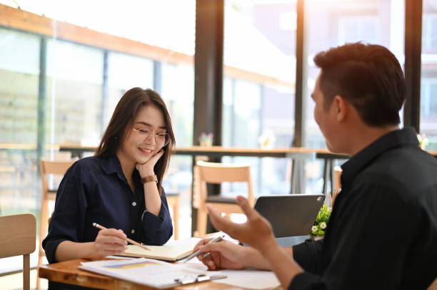 istock Woman and Man talking with business topic on office table. 1152567877