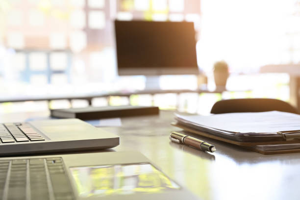 istock Business workspace, Pen and work paper document with laptop on office table. 1152567895