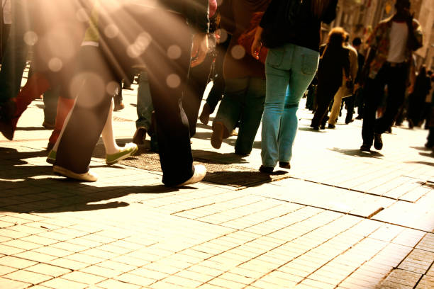 istock close up crowded people walking on busy street 1152568473