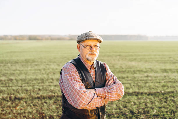 istock Adult farmer checking plants on his farm. 1152568492