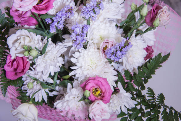 istock A modern, beautiful floral bouquet on a purple background. 1152568555