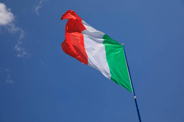 istock Italian flags fluttering in the wind. Blue sky in the background. 1152570326