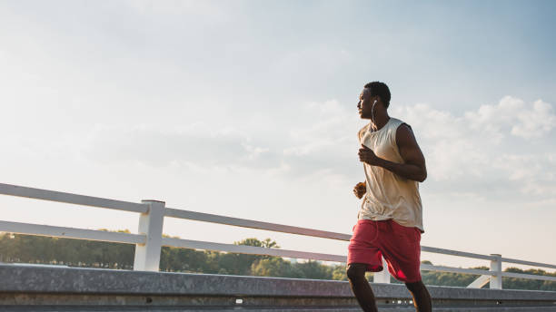 istock Young African-American male jogging 1152570534