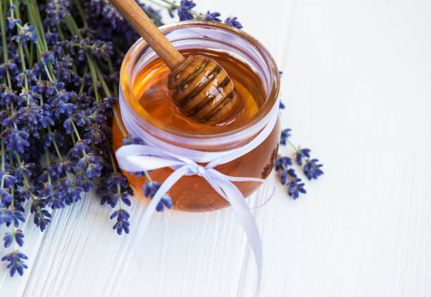 istock Jar with honey and fresh lavender flowers 1152571169