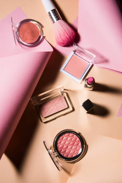 istock Professional makeup tools with colorful curves paper background. 1152571517