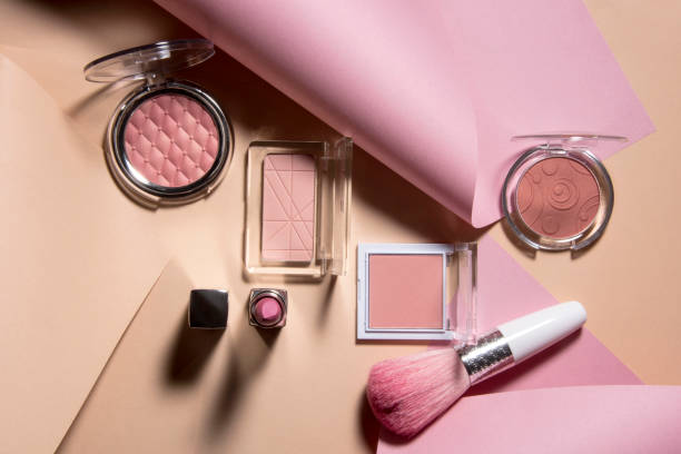 Professional makeup tools with colorful curves paper background.