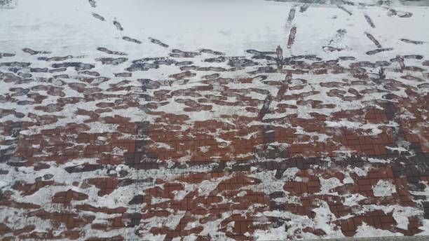 istock boot or shoes print on snow surface white background 1152574969