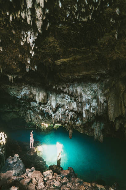 istock Woman standing in cave on Flores Island 1152575850