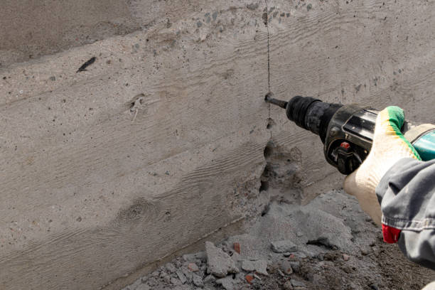 istock People are using electric drill,He drilled concrete to put steel anchor. 1152576018